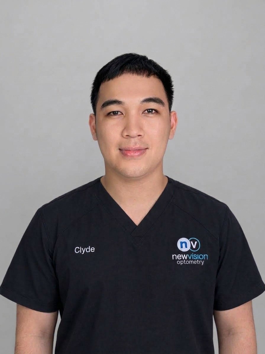 Portrait of Clyde, RN and Medical Scribe, in black New Vision Optometry scrubs