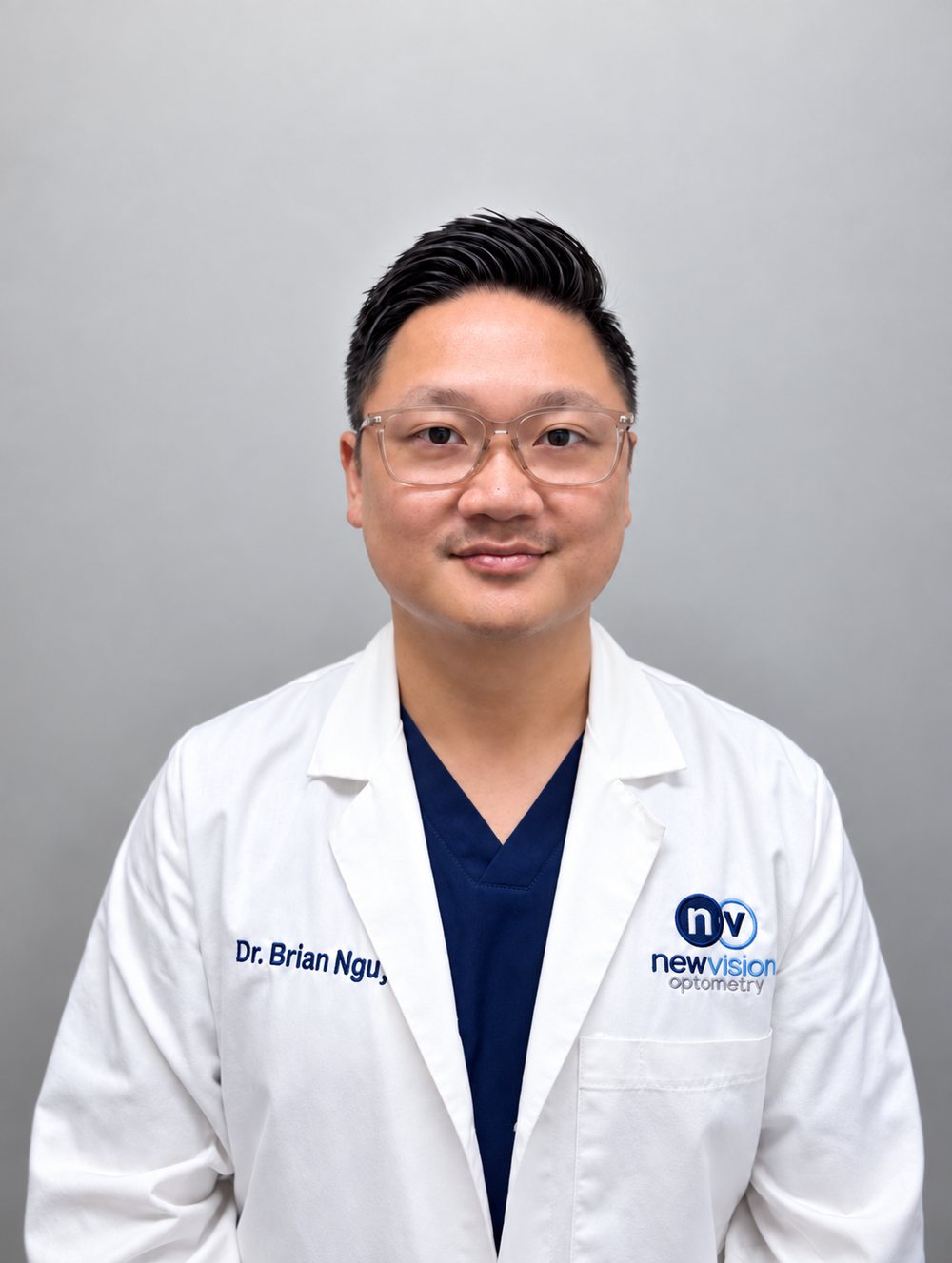 Portrait of Dr. Long Nguyen, O.D., in a white coat with the New Vision Optometry mark, photographed in September 2026