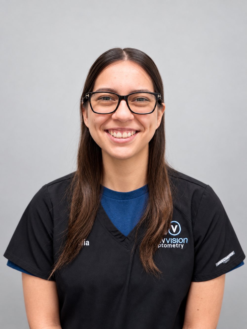 Portrait of Sofia, Team Lead, in black New Vision Optometry scrubs